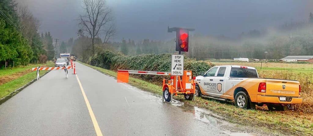A road closure using aan automatic flagging machine, automated flagging device to keep flaggers safe.